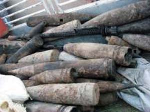Mortar rounds and other improvised explosive device-making materials were turned over to Coalition Forces by the "Neighborhood Watch" in Taji, Iraq June 25. U.S. Army photo.